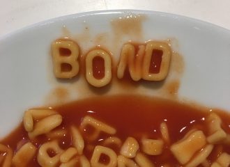 Word Bond written in alphabet pasta in dinner plate