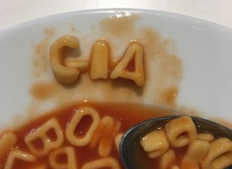 Word GIA written in alphabet pasta in dinner plate