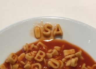 ISA written with alphabet pasta in dinner plate