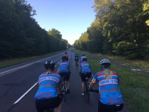 Picture of cycling club riding away