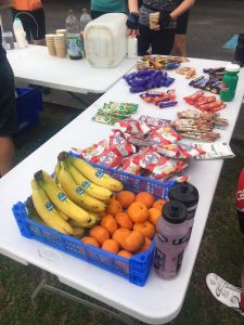 Water stop during cycle ride with fresh fruit and sweets/snacks