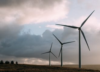 3 wind turbines in the countryside-cloudy sky