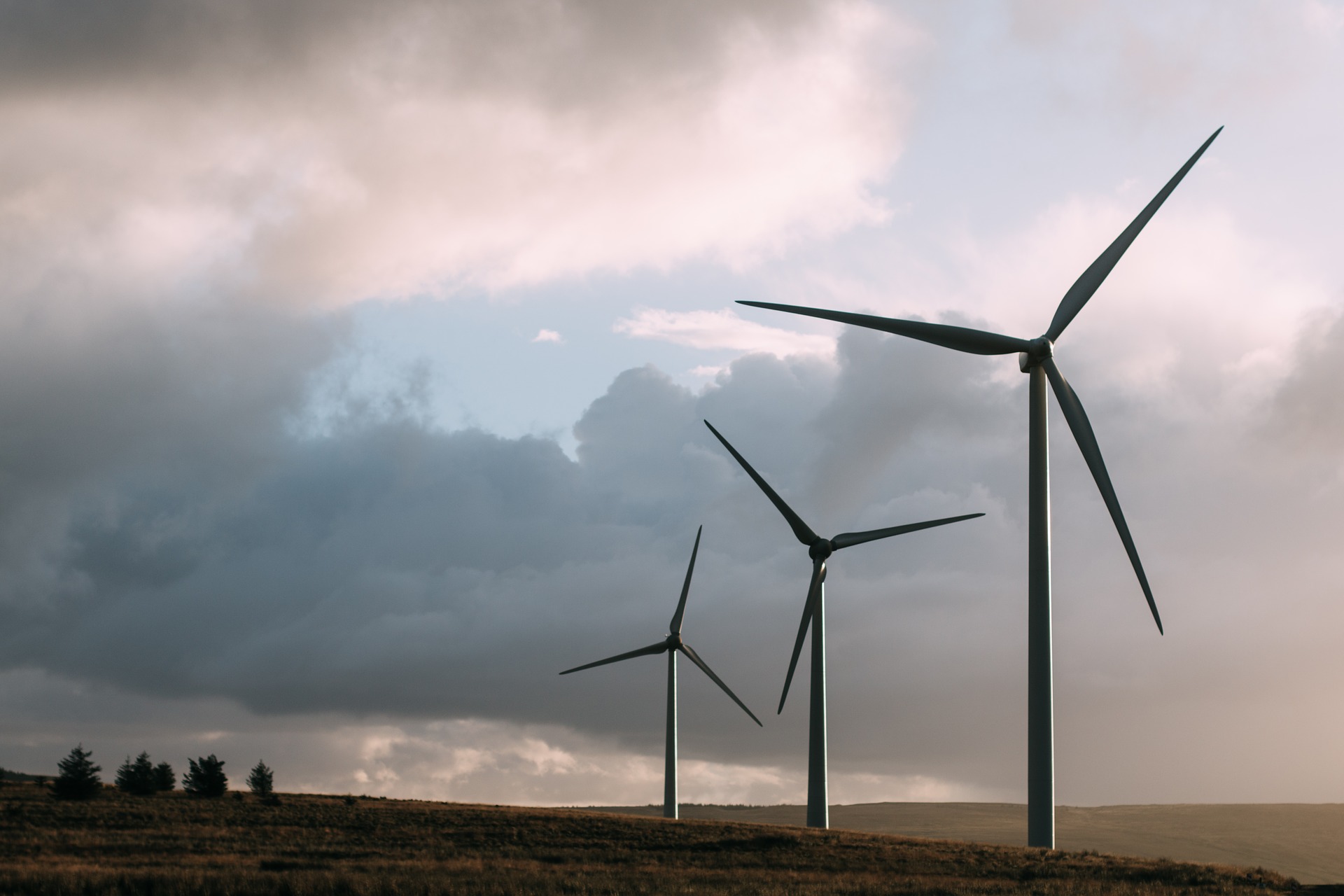 3 wind turbines in the countryside-cloudy sky