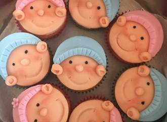 Pink and blue baby face cakes