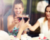 Happy women drinking wine