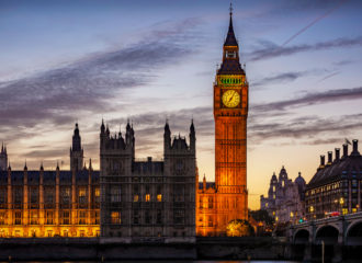 An external image of the Palace of Westminster in the evening