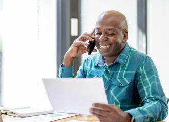 Happy business owner on the phone